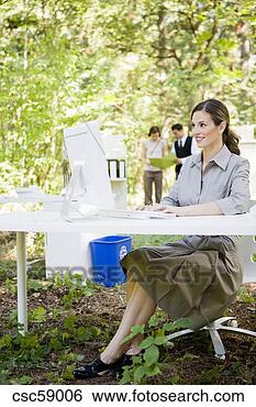 Stock Photo - businesswoman 
at desk in woods. 
fotosearch - search 
stock photos, 
pictures, images, 
and photo clipart