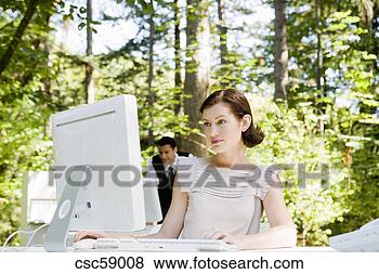 Stock Photo - businesswoman 
at desk in woods. 
fotosearch - search 
stock photos, 
pictures, images, 
and photo clipart