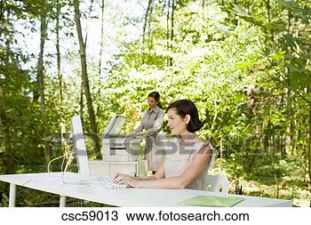 Stock Photo - businesswoman 
at desk in woods. 
fotosearch - search 
stock photos, 
pictures, images, 
and photo clipart