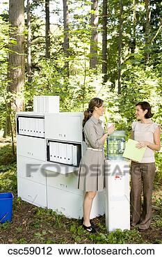 Stock Photo - businesswomen 
talking at water 
cooler in woods. 
fotosearch - search 
stock photos, 
pictures, images, 
and photo clipart