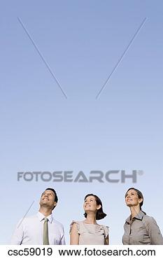 Stock Photograph - three businesspeople 
looking up. fotosearch 
- search stock 
photos, pictures, 
images, and photo 
clipart