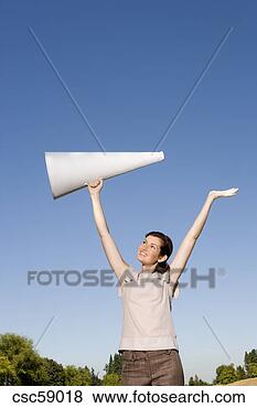 Stock Photo - woman holding 
megaphone over 
head. fotosearch 
- search stock 
photos, pictures, 
images, and photo 
clipart