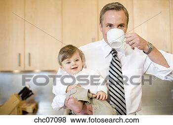 Stock Photo - father holding 
baby and drinking 
coffee. fotosearch 
- search stock 
photos, pictures, 
images, and photo 
clipart