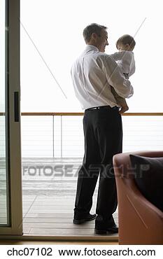 Stock Photo - father holding 
baby on deck. 
fotosearch - search 
stock photos, 
pictures, images, 
and photo clipart