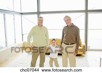 Stock Photo - grandfather and 
father holding 
son’s hands. fotosearch 
- search stock 
photos, pictures, 
images, and photo 
clipart