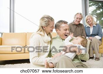 Picture - multi-generational 
family in living 
room. fotosearch 
- search stock 
photos, pictures, 
images, and photo 
clipart
