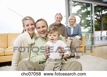 Stock Photo - multi-generational 
family in living 
room. fotosearch 
- search stock 
photos, pictures, 
images, and photo 
clipart