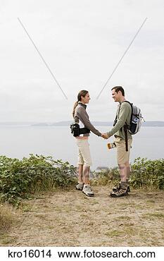 Stock Photo - couple holding 
hands. fotosearch 
- search stock 
photos, pictures, 
images, and photo 
clipart