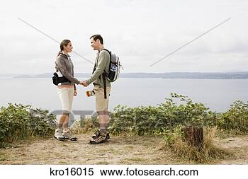 Stock Image - couple holding 
hands. fotosearch 
- search stock 
photos, pictures, 
images, and photo 
clipart