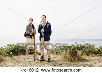 Stock Photo - couple holding 
hiking poles. 
fotosearch - search 
stock photos, 
pictures, images, 
and photo clipart