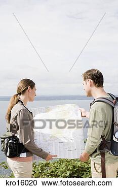 Stock Photography - couple looking 
at map. fotosearch 
- search stock 
photos, pictures, 
images, and photo 
clipart