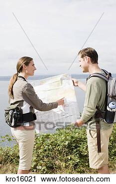 Stock Photography - couple looking 
at map. fotosearch 
- search stock 
photos, pictures, 
images, and photo 
clipart