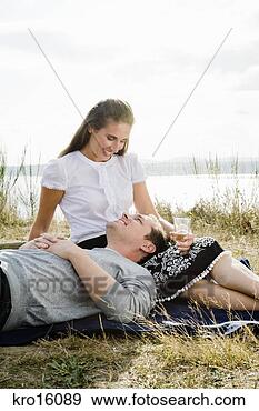 Stock Photograph - man laying in 
girlfriend’s lap. 
fotosearch - search 
stock photos, 
pictures, images, 
and photo clipart