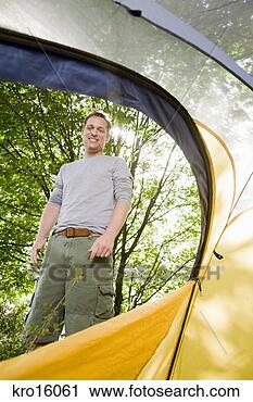 Stock Photography - man looking into 
tent. fotosearch 
- search stock 
photos, pictures, 
images, and photo 
clipart