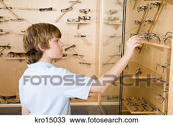 Stock Photo - boy reaching for 
eyeglasses. fotosearch 
- search stock 
photos, pictures, 
images, and photo 
clipart