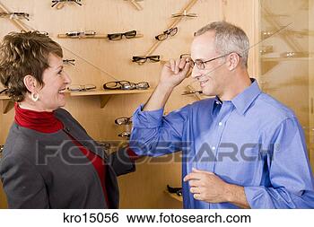 Stock Photo - couple in optician’s 
office. fotosearch 
- search stock 
photos, pictures, 
images, and photo 
clipart