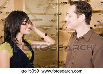 Stock Photograph - couple in optician’s 
office. fotosearch 
- search stock 
photos, pictures, 
images, and photo 
clipart