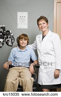Stock Image - female ophthalmologist 
with boy in office. 
fotosearch - search 
stock photos, 
pictures, images, 
and photo clipart