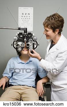 Stock Photo - female ophthalmologist 
examining boy. 
fotosearch - search 
stock photos, 
pictures, images, 
and photo clipart