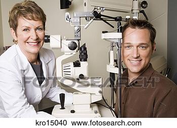 Stock Photography - female ophthalmologist 
examining man. 
fotosearch - search 
stock photos, 
pictures, images, 
and photo clipart