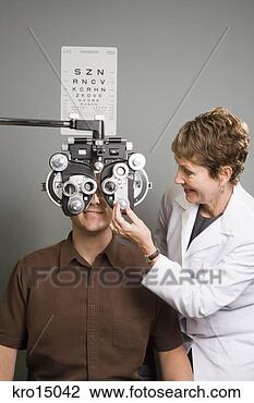 Stock Photo - female ophthalmologist 
examining man. 
fotosearch - search 
stock photos, 
pictures, images, 
and photo clipart