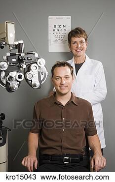 Stock Photo - female ophthalmologist 
and man in office. 
fotosearch - search 
stock photos, 
pictures, images, 
and photo clipart