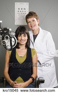 Stock Image - female ophthalmologist 
and woman in office. 
fotosearch - search 
stock photos, 
pictures, images, 
and photo clipart