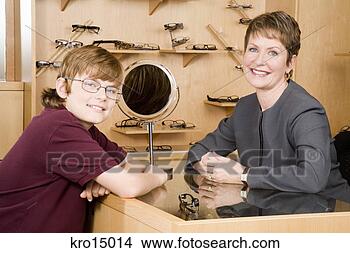 Stock Photo - female optician 
with boy in office. 
fotosearch - search 
stock photos, 
pictures, images, 
and photo clipart