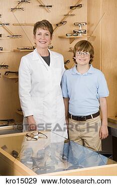 Stock Photograph - female optician 
and boy in office. 
fotosearch - search 
stock photos, 
pictures, images, 
and photo clipart