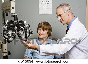 Stock Photo - male ophthalmologist 
with boy in office. 
fotosearch - search 
stock photos, 
pictures, images, 
and photo clipart
