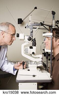 Stock Photo - male ophthalmologist 
examining man. 
fotosearch - search 
stock photos, 
pictures, images, 
and photo clipart