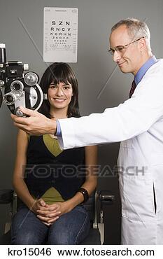 Stock Photo - male ophthalmologist 
and woman in office. 
fotosearch - search 
stock photos, 
pictures, images, 
and photo clipart