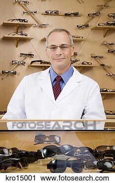 Stock Photography - male optician 
behind counter. 
fotosearch - search 
stock photos, 
pictures, images, 
and photo clipart