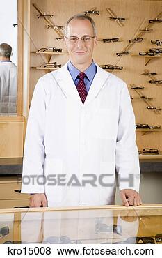 Stock Photo - male optician 
behind counter. 
fotosearch - search 
stock photos, 
pictures, images, 
and photo clipart