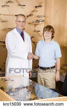 Stock Photography - male optician 
shaking hands 
with boy. fotosearch 
- search stock 
photos, pictures, 
images, and photo 
clipart
