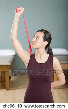 Stock Photography - asian woman exercising 
with elastic band. 
fotosearch - search 
stock photos, 
pictures, images, 
and photo clipart