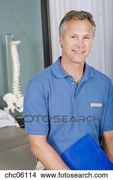 Stock Photo - male physical 
therapist holding 
chart. fotosearch 
- search stock 
photos, pictures, 
images, and photo 
clipart