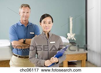 Picture - multi-ethnic physical 
therapists in 
office. fotosearch 
- search stock 
photos, pictures, 
images, and photo 
clipart
