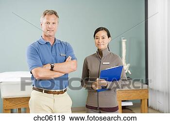 Stock Photograph - multi-ethnic physical 
therapists in 
office. fotosearch 
- search stock 
photos, pictures, 
images, and photo 
clipart