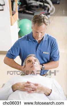 Stock Photography - physical therapist 
stretching man’s 
neck. fotosearch 
- search stock 
photos, pictures, 
images, and photo 
clipart