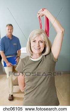 Stock Image - senior woman exercising 
with elastic band. 
fotosearch - search 
stock photos, 
pictures, images, 
and photo clipart