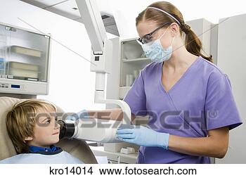 Stock Photo - boy having x-ray 
taken at dentist. 
fotosearch - search 
stock photos, 
pictures, images, 
and photo clipart