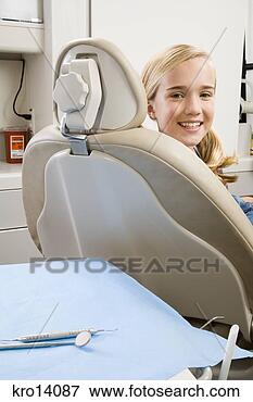 Picture - girl sitting in 
dental chair. 
fotosearch - search 
stock photos, 
pictures, images, 
and photo clipart