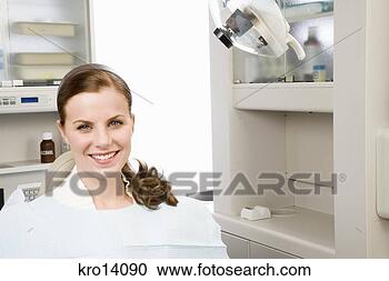 Stock Photography - woman sitting 
in dental chair. 
fotosearch - search 
stock photos, 
pictures, images, 
and photo clipart