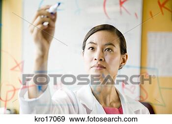 Stock Photograph - asian female scientist 
writing on clear 
board. fotosearch 
- search stock 
photos, pictures, 
images, and photo 
clipart
