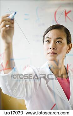 Stock Photography - asian female scientist 
writing on clear 
board. fotosearch 
- search stock 
photos, pictures, 
images, and photo 
clipart