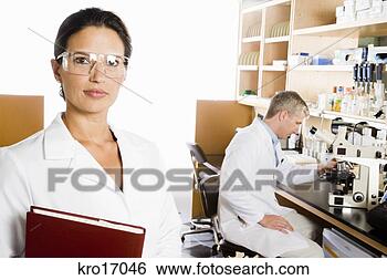 Stock Photo - female scientist 
wearing protective 
eyewear. fotosearch 
- search stock 
photos, pictures, 
images, and photo 
clipart
