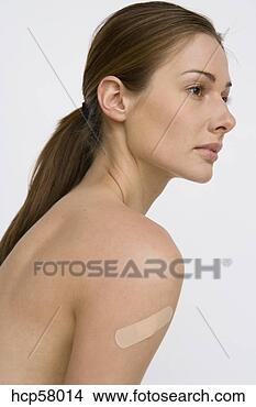 Stock Photo - nude woman with 
bandage on shoulder. 
fotosearch - search 
stock photos, 
pictures, images, 
and photo clipart