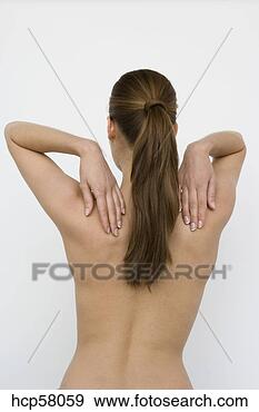Stock Photograph - nude woman touching 
shoulders. fotosearch 
- search stock 
photos, pictures, 
images, and photo 
clipart