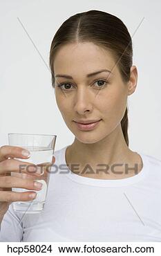 Stock Photo - young woman drinking 
water. fotosearch 
- search stock 
photos, pictures, 
images, and photo 
clipart